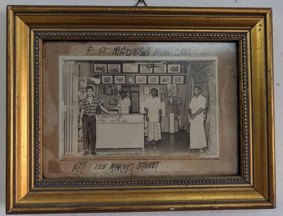 Sultan Maricar (far left) at the original Market Street framing shop, where the family business was founded in 1924